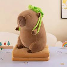 peluche capybara con manta