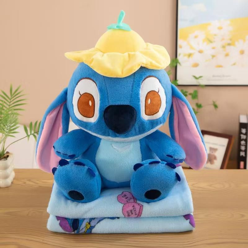 peluche stitch con manta  gorrito amarillo 35cm